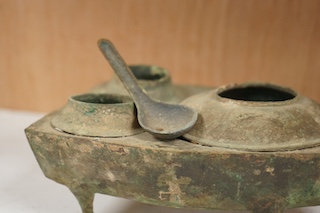 A Chinese Han Dynasty bronze brazier and vessels, width 22.5cm., Condition - spout has cracks to end